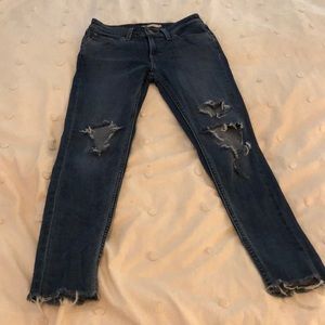 Super distressed Levi’s skinny jeans